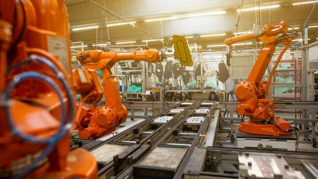 Automated production line with robot arms in a modern manufacturing plant