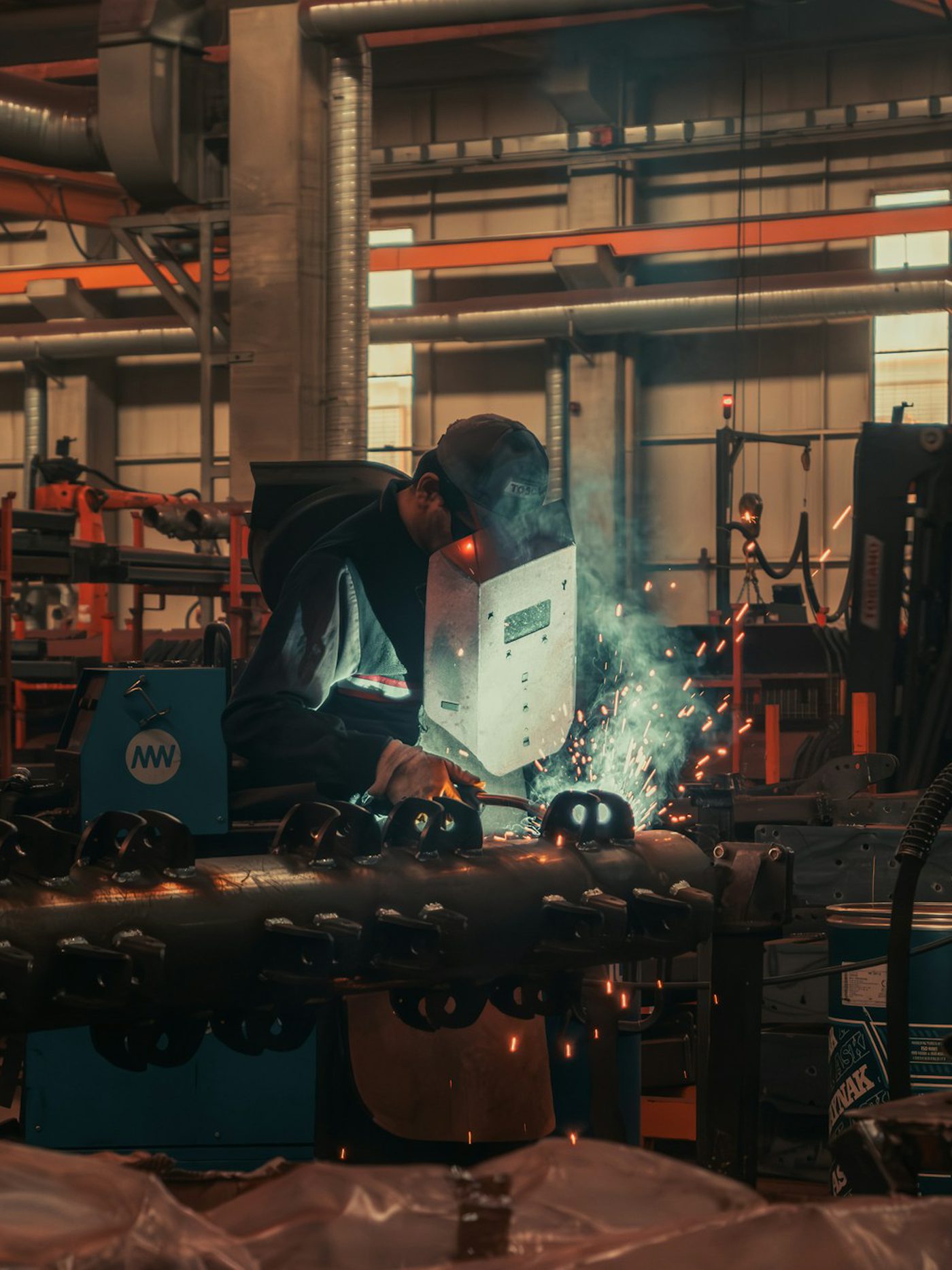 Manufacturing engineer setting up an industrial injection moulding machine in Melbourne