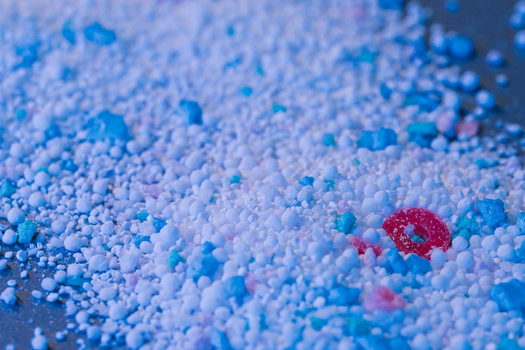 Close-up of recycled plastic resin pellets and regrind ready for injection moulding